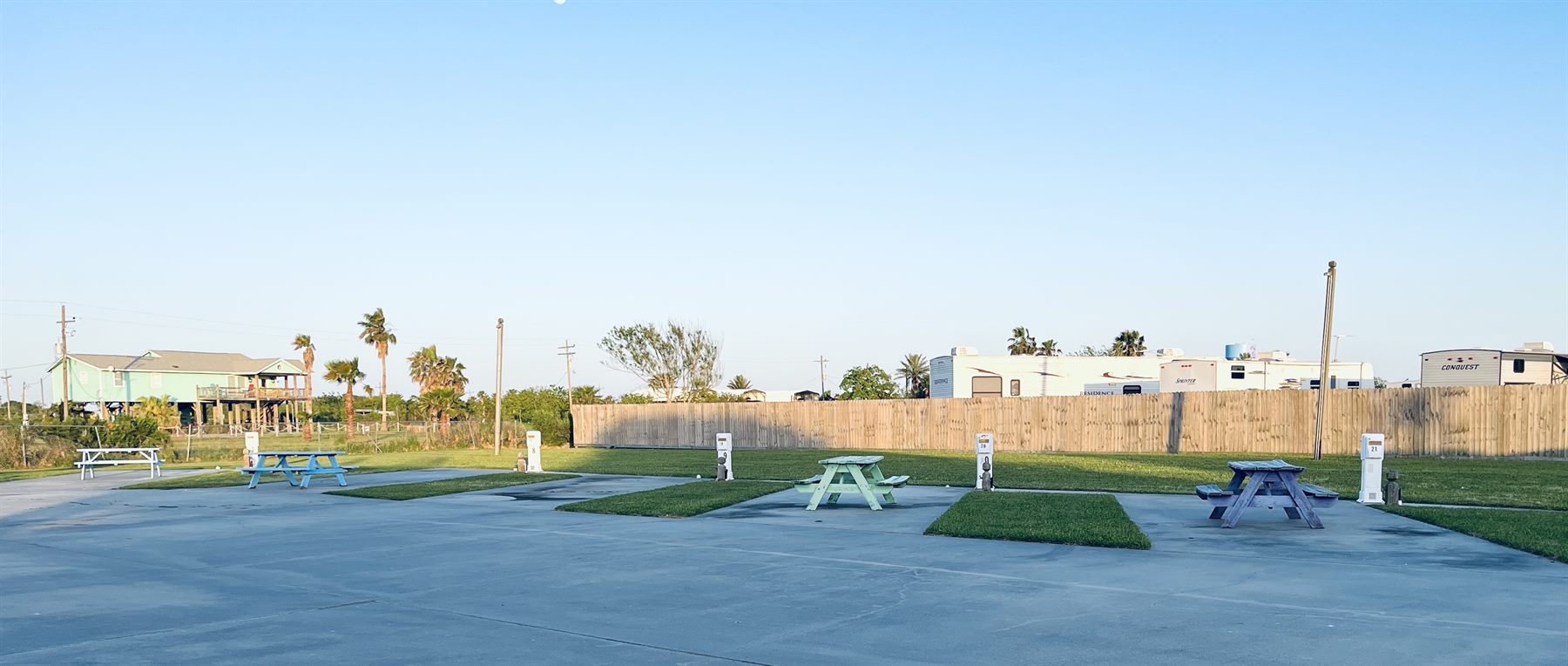 wide concrete RV pads and picnic tables at The Palms